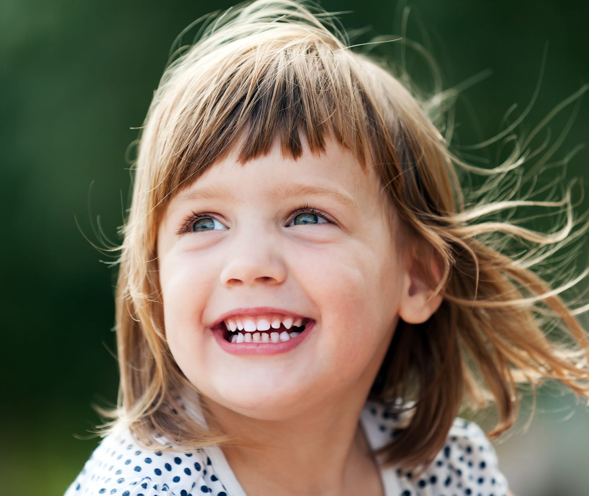 A joyful child at a preschool and kindergarten, thriving in an early childhood learning environment focused on discovery and growth